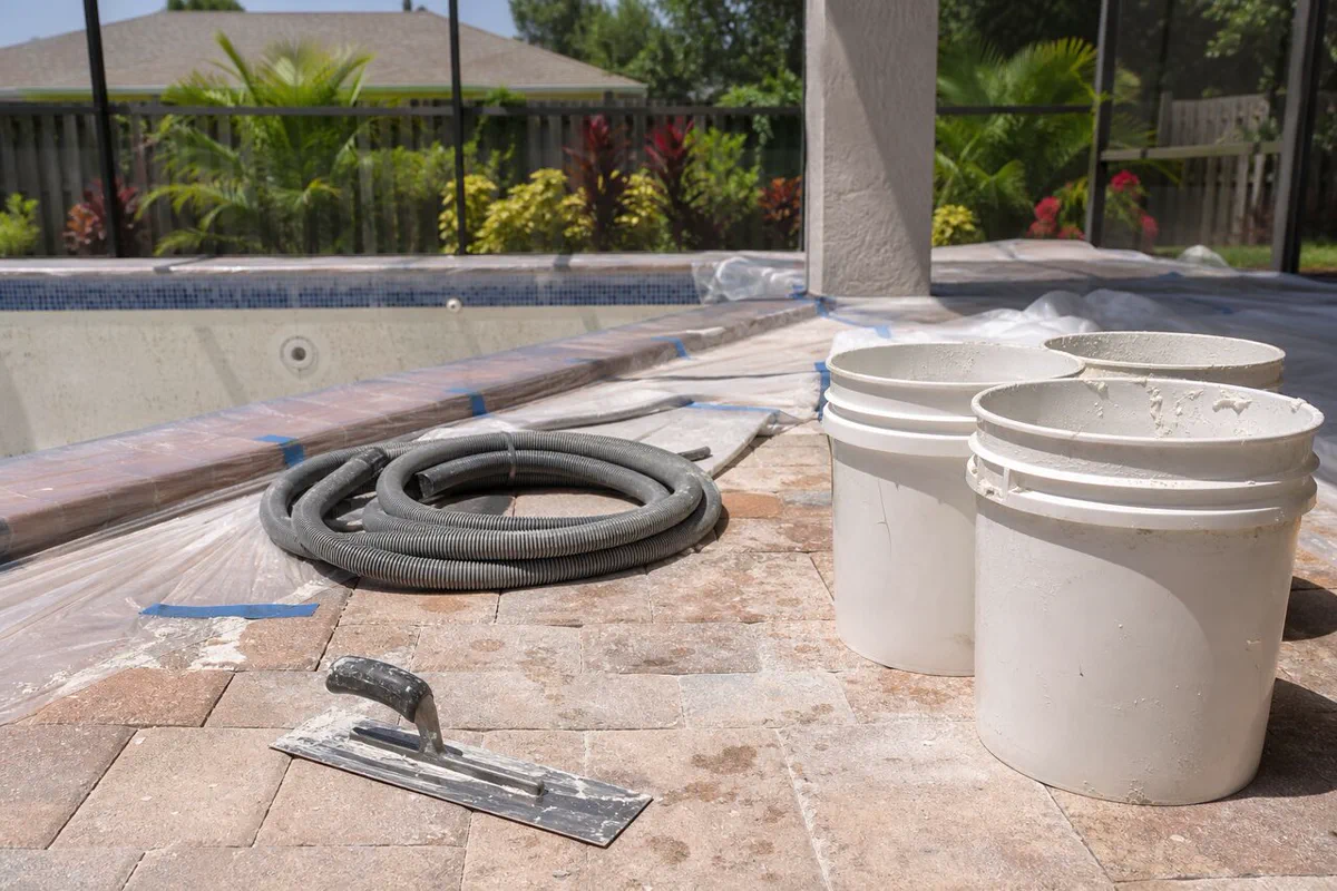 Finished pebble aggregate pool surface with visible stone texture